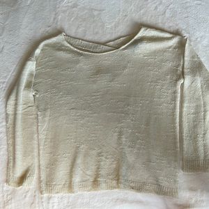 White knit sweater with cross cross back.